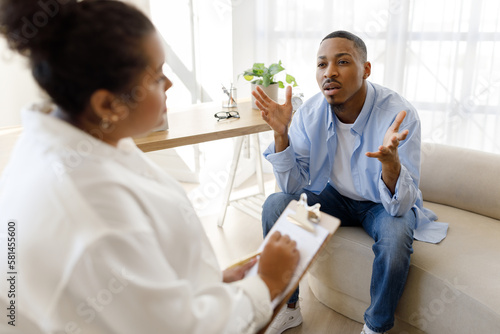 Anxious black man experiencing midlife crisis, have therapy session
