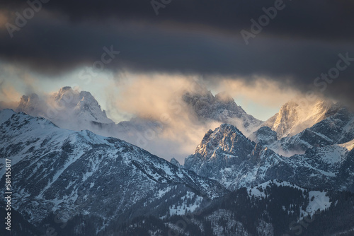 Winter scenery of Tatra Mountains at cloudy sunrise. Poland