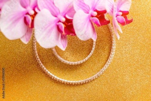 Bracelet and necklace on a gold shiny background
