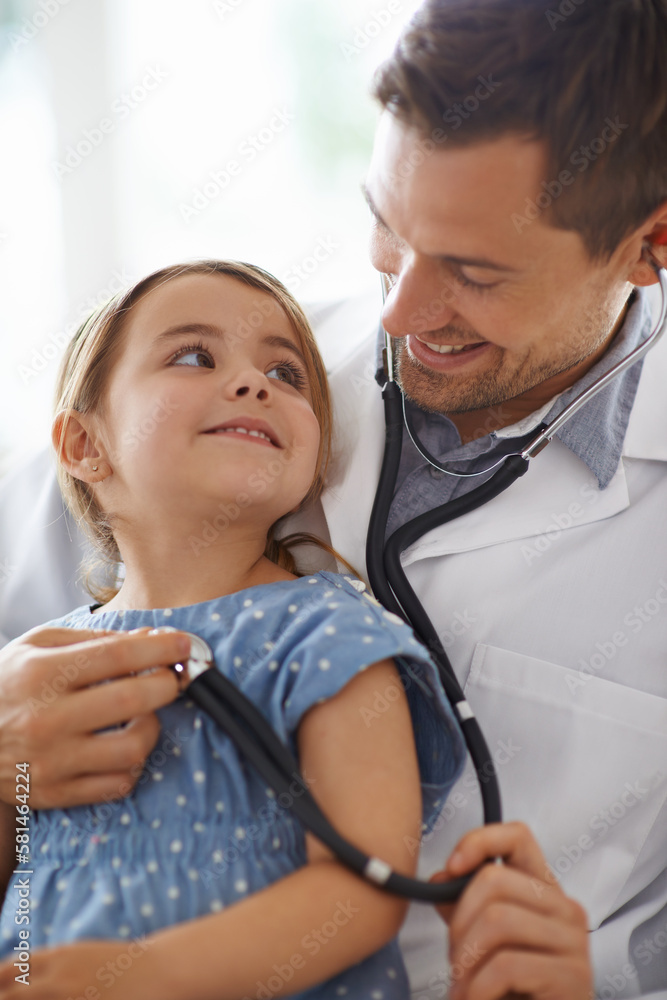 Breathe in. an adorable young girl with her pediatrician. Breathe in. an adorable young girl with her pediatrician.