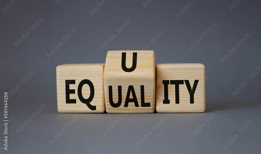 ICO vs IPO symbol. Turned wooden cubes with words Equality and Equity. Beautiful grey background. Equity and Equality and business concept. Copy space ICO vs IPO symbol. Turned wooden cubes with words Equality and Equity. Beautiful grey background. Equity and Equality and business concept. Copy space