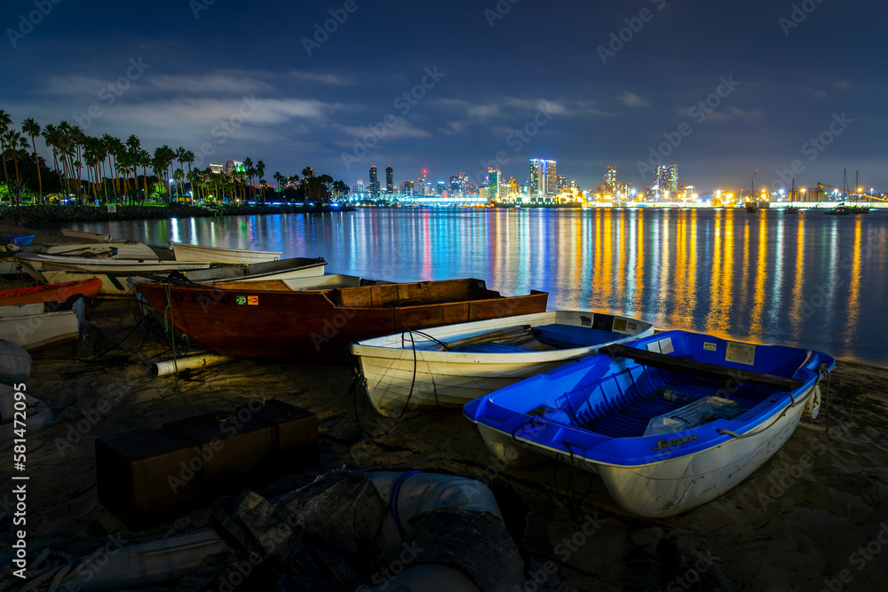 Boats on Coronado island, San Diego bay and skyline at night, California