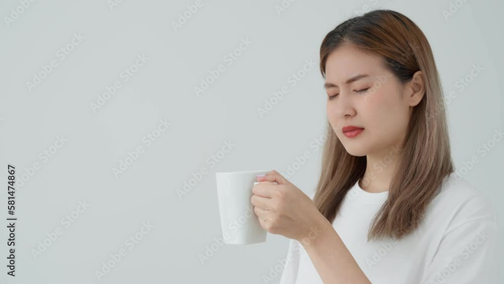 Asian woman feel sensitive teeth after drinking hot, female suffer tooth, decay problems, dental care, tooth extraction, decay problem, bad breath, Gingival Recession, Oral Hygiene instruction Asian woman feel sensitive teeth after drinking hot, female suffer tooth, decay problems, dental care, tooth extraction, decay problem, bad breath, Gingival Recession, Oral Hygiene instruction