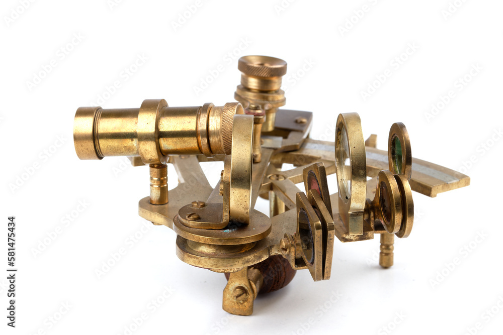 nautical sextant with optics lying on paper world map nautical sextant with optics lying on paper world map