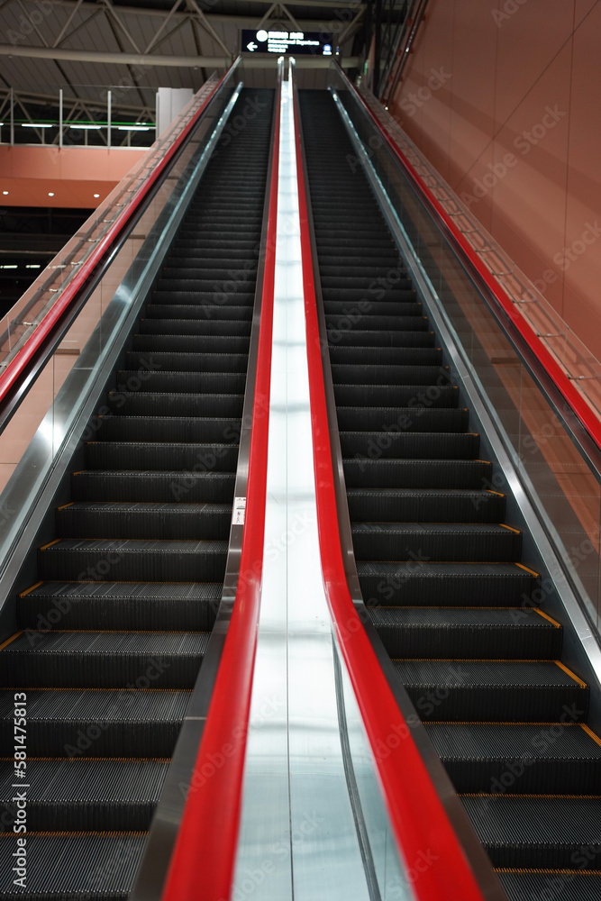 Long escalator with red handle