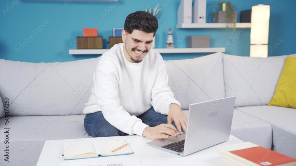 Happy home office worker looking at laptop and smiling.
Young man satisfied with his job. He looks at the laptop and laughs.
Happy home office worker looking at laptop and smiling.
Young man satisfied with his job. He looks at the laptop and laughs.