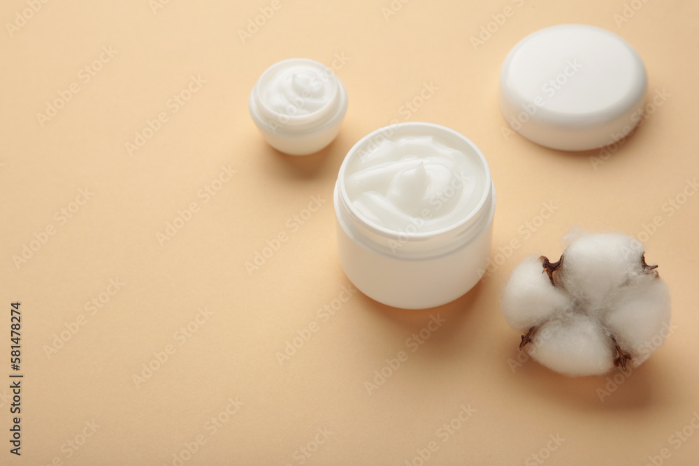 Face cream moisturizer in a jar on beige background. Luxury skincare cosmetics and anti-aging product for healthy skin and beauty routine Face cream moisturizer in a jar on beige background. Luxury skincare cosmetics and anti-aging product for healthy skin and beauty routine