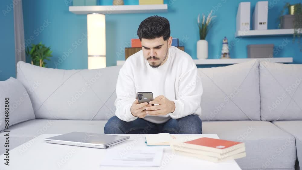 The guy who puts down the phone and goes back to work.
The young man playing on the phone reluctantly hangs up the phone and continues his work.
The guy who puts down the phone and goes back to work.
The young man playing on the phone reluctantly hangs up the phone and continues his work.