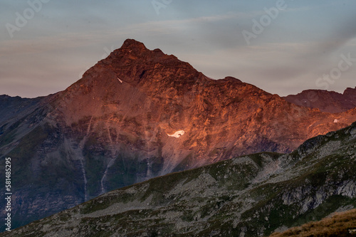 Sunset on top of a mountain in the mountains in the Austrian Alps in the Hohe Tauern mountains