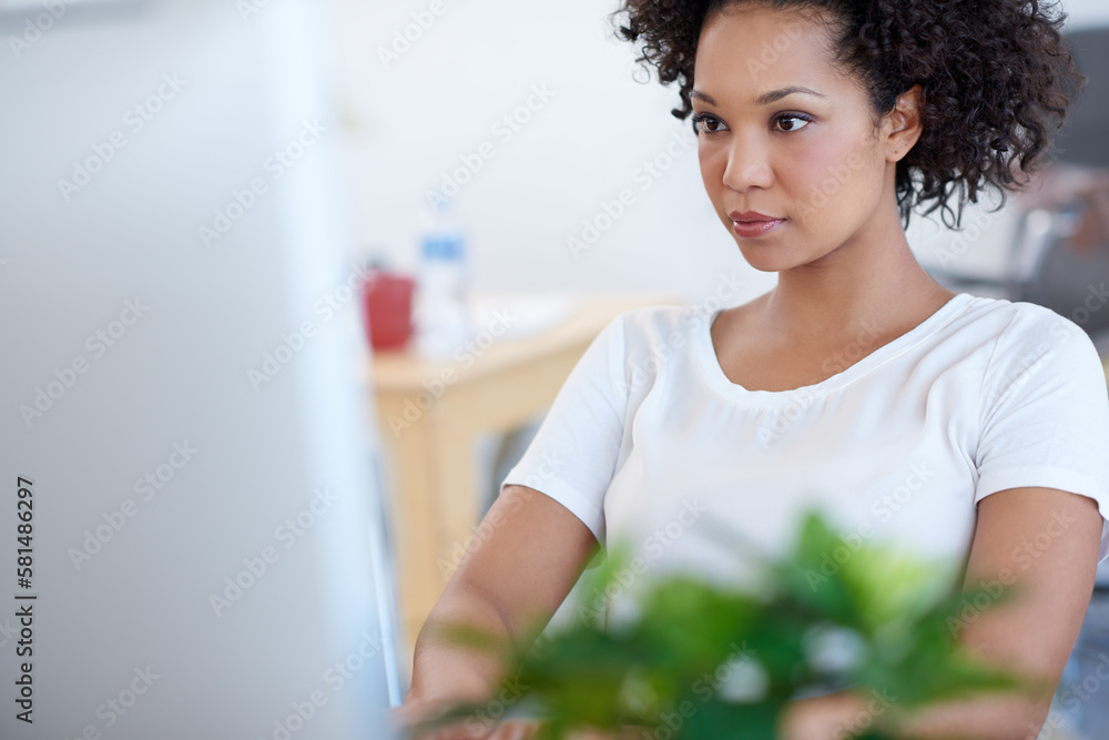 Working towards a secure future. Tilted view of a beautiful businesswoman working on her pc at the desk. Working towards a secure future. Tilted view of a beautiful businesswoman working on her pc at the desk.