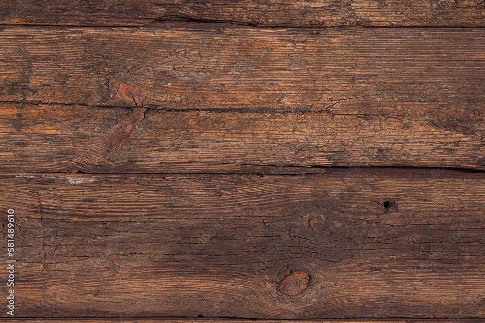 Background of old brown boards with visible grain and damage. Background of old brown boards with visible grain and damage.