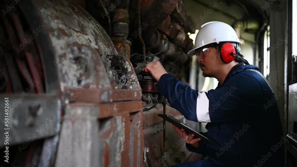 Engine engineer inspecting large machines in factory,Railway engine maintenance technician,engine repair mechanical manager Engine engineer inspecting large machines in factory,Railway engine maintenance technician,engine repair mechanical manager