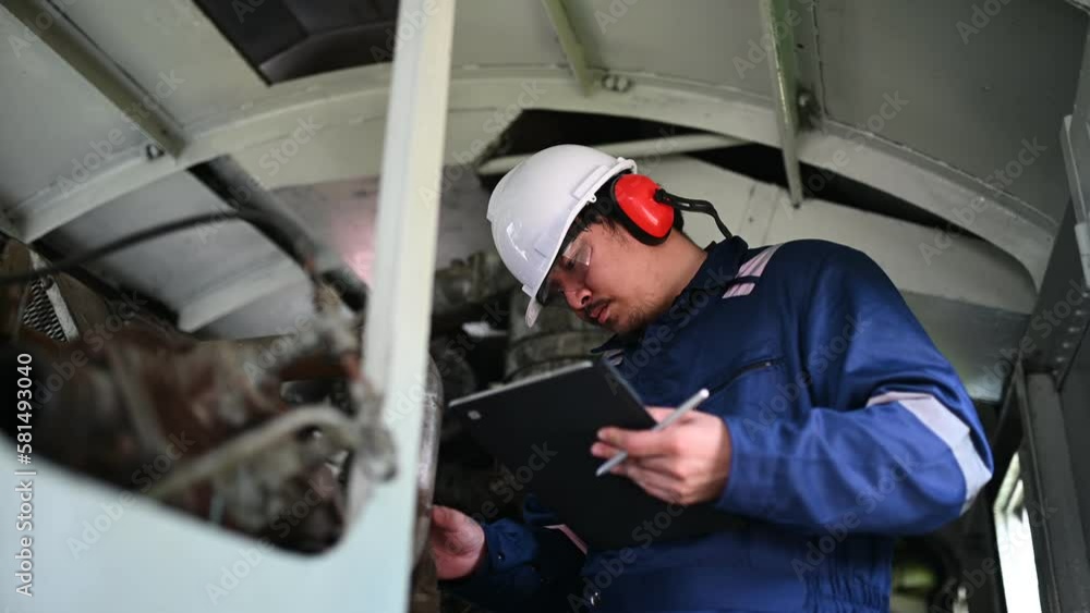 Engine engineer inspecting large machines in factory,Railway engine maintenance technician,engine repair mechanical manager Engine engineer inspecting large machines in factory,Railway engine maintenance technician,engine repair mechanical manager