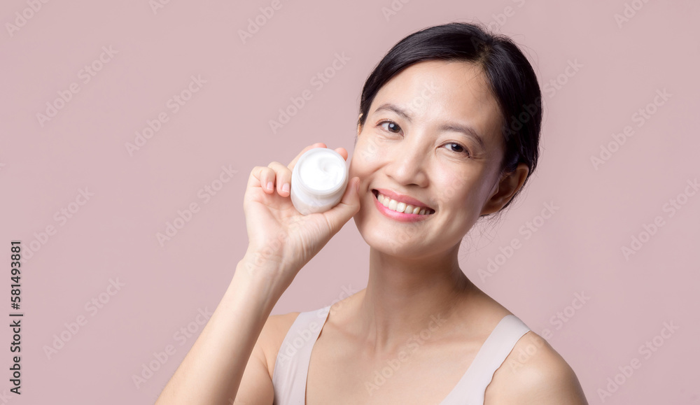Young asian woman with facial skincare face cream, cosmetic moisturiser on healthy natural skin make up face. Portrait glowing smile girl person model with care beauty product, spa, cosmetology. Young asian woman with facial skincare face cream, cosmetic moisturiser on healthy natural skin make up face. Portrait glowing smile girl person model with care beauty product, spa, cosmetology.