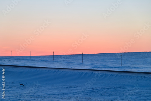 Orange Twilight Sky Over Snow Hills in Irkutsk Oblast  Siberia