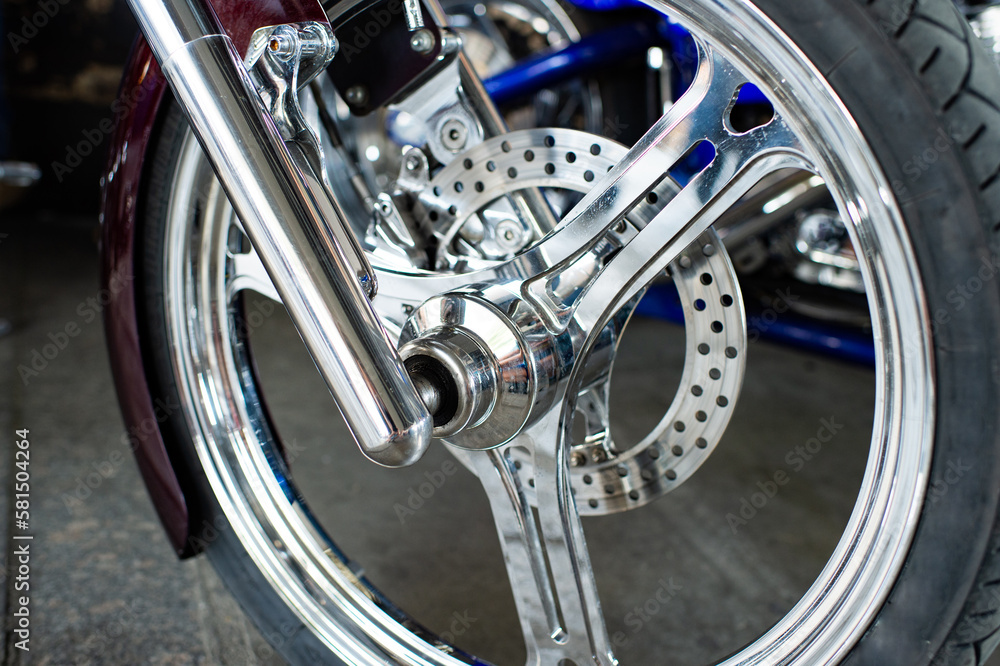 Detailed front wheel with chrome spokes of custombike custom motorcycle or chopper bike