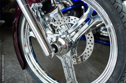 Detailed front wheel with chrome spokes of custombike custom motorcycle or chopper bike photo