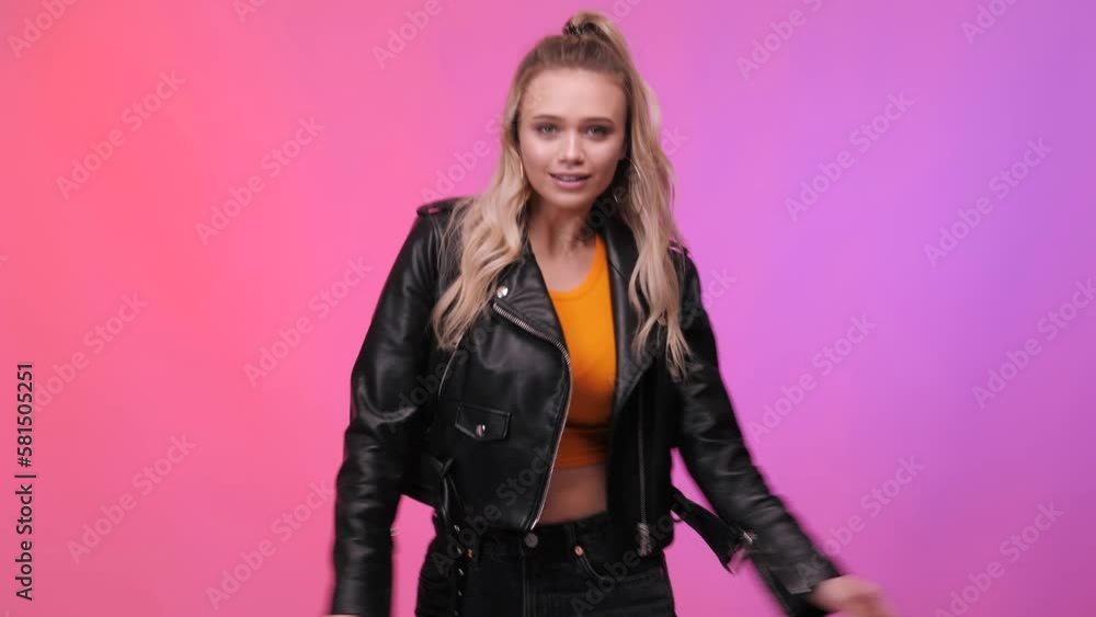 Happy european girl dancing. Party, music, lifestyle, radio and disco. Dancing woman. Studio background. Young handsome woman dancing and having fun, moving arms listening to music. Happy european girl dancing. Party, music, lifestyle, radio and disco. Dancing woman. Studio background. Young handsome woman dancing and having fun, moving arms listening to music.