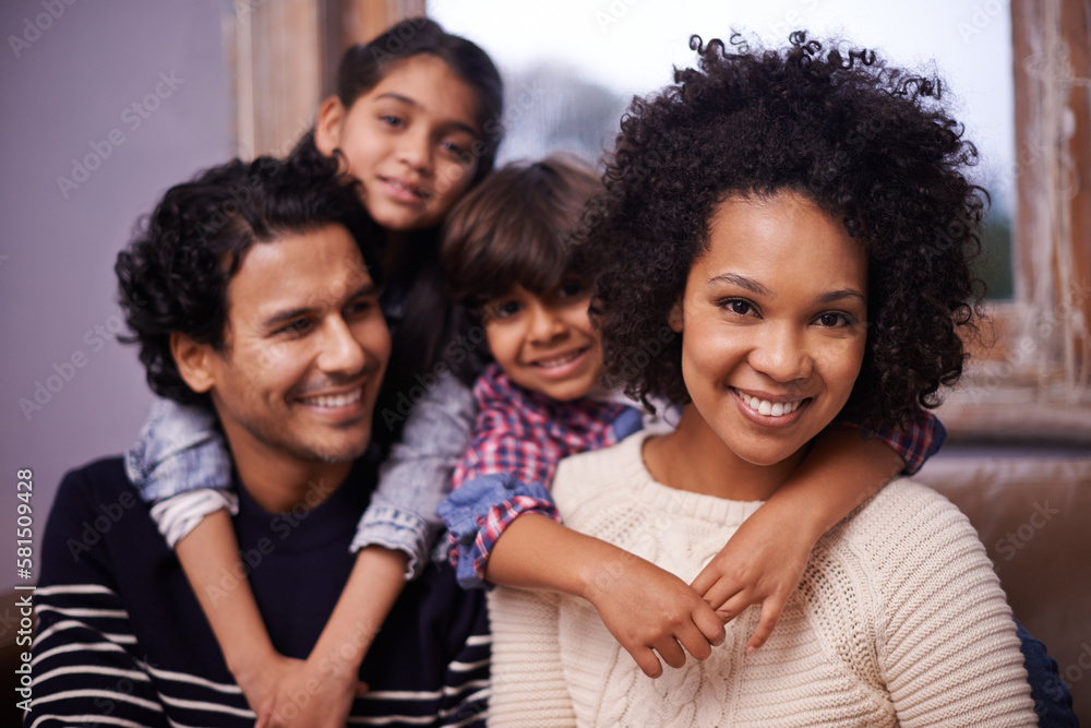 Obraz premium Theres no better joy than having a family. Portrait of a happy family of four at home.