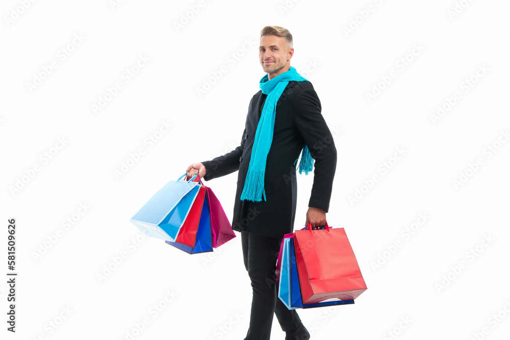 positive shopping man with purchase isolated on white. shopping man with purchase in studio. positive shopping man with purchase isolated on white. shopping man with purchase in studio.