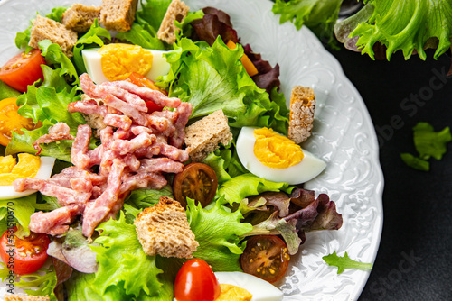 bacon salad, Vosges salad, egg, crouton, lettuce, salad dressing vinaigrette Lorraine cuisine healthy meal food snack on the table copy space food background rustic top view
