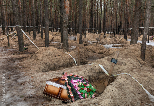 Mass grave site near Izium for civilian victims of war photo