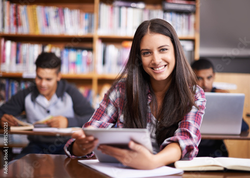 Getting down to some studying. Portrait of an attractive female student using her digital tablet during class. © Hova/peopleimages.com