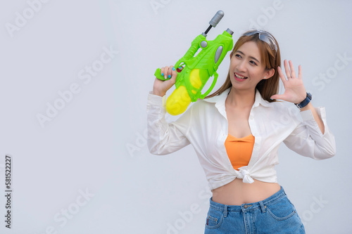 Asian sexy woman with water in hand on white background,Festival songkran day at thailand,The best of festival of thai,Land of  smile © reewungjunerr