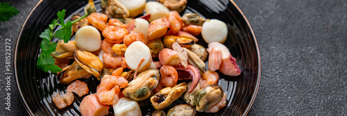 seafood salad shrimp, mussel, scallop, octopus healthy meal food snack on the table copy space food background rustic top view pescatarian diet