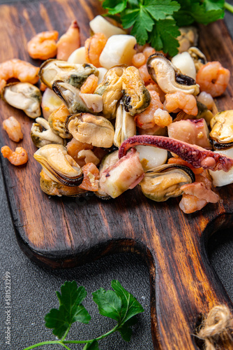 seafood salad shrimp, mussel, scallop, octopus healthy meal food snack on the table copy space food background rustic top view pescatarian diet
