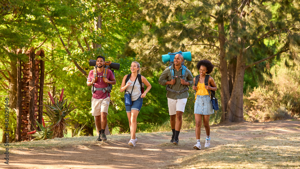Group Of Friends With Backpacks On Vacation Hiking Through Forest Countryside Together Group Of Friends With Backpacks On Vacation Hiking Through Forest Countryside Together