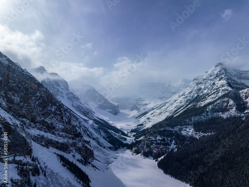 aerial view of mountain peaks at frozen luise lake