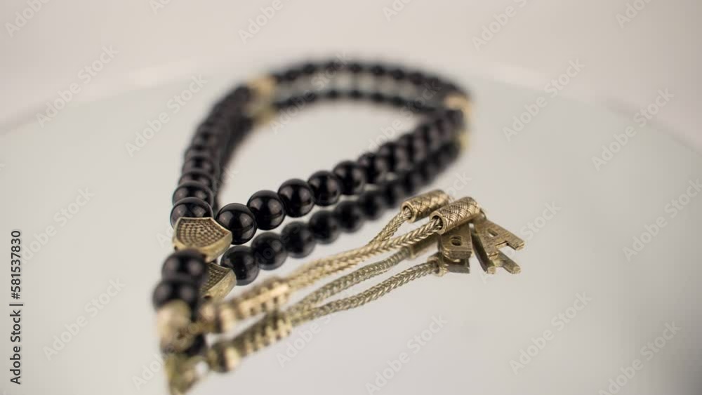 a isolated black beaded rosary on a white background rotating platform a isolated black beaded rosary on a white background rotating platform