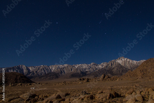 camping in the Alabama Hills, outside of Lone Pine, California, with views of the Eastern Sierra Nevada Mountains covered in snow. Mt langley and Mt Whitney can be seen.
