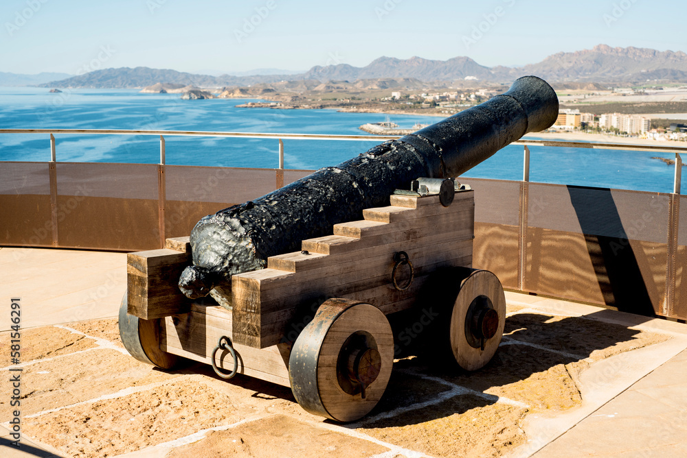 cannon on the background of the sea and mountains in oman