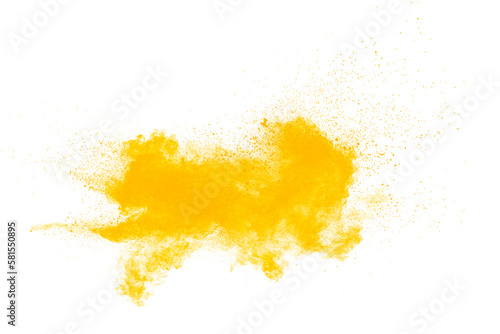 Abstract yellow powder explosion on white background. Freeze motion of yellow dust particles splash.