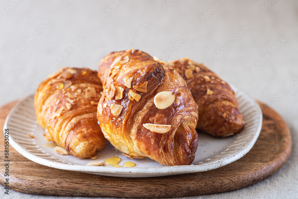 Almond croissant bakery homemade on the table. Almond croissant bakery homemade on the table.