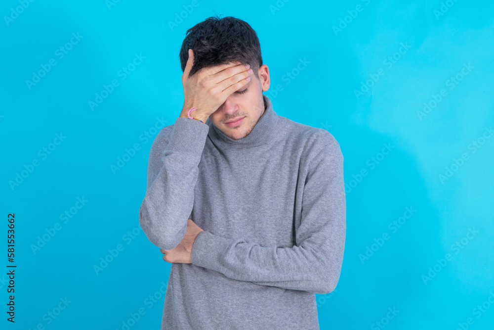 young man isolated on background with sorry expression young man isolated on background with sorry expression