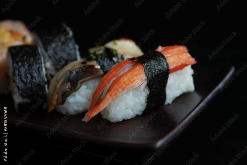 Mixed Japanese food, Sushi Roll, on black background Mixed Japanese food, Sushi Roll, on black background