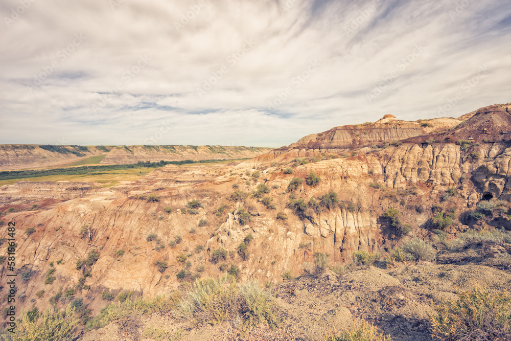 Landscape of the Badlands of Drumheller with a textured sky