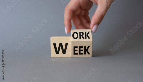 Work Week symbol. Businessman hand Turnes cubes with words Work Week. Beautiful grey background. Business and Work Week concept. Copy space