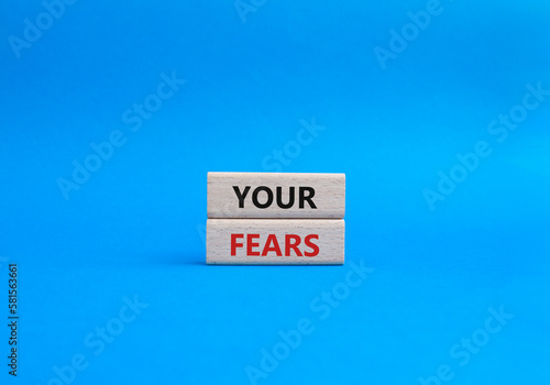 Your fears symbol. Wooden blocks with words Your fears. Beautiful blue background. Business and Your fears concept. Copy space.