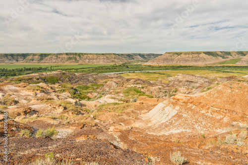 Landscape of the Badlands of Drumheller with the Red Deer River in the distance