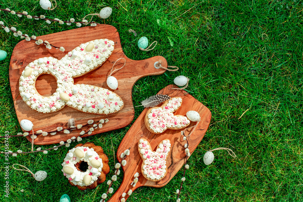cake for easter.easter bunny with easter eggs and willow on green grass with copy space for your text cake for easter.easter bunny with easter eggs and willow on green grass with copy space for your text