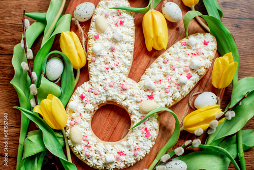 easter cake. easter bunny with easter eggs and willow on wooden background  © александр таланцев