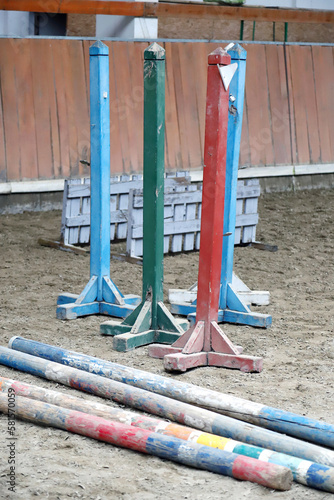 Show jumping poles obstacles, barriers, waiting for riders photo