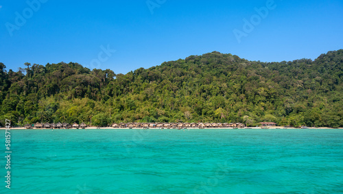 Ko Surin Marine National Park. Traditional houses of Moken tribe Village or Sea Gypsies and tropical waters of Surin Islands in Thailand, Phang Nga. photo