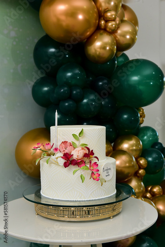 white party cake with flowers 