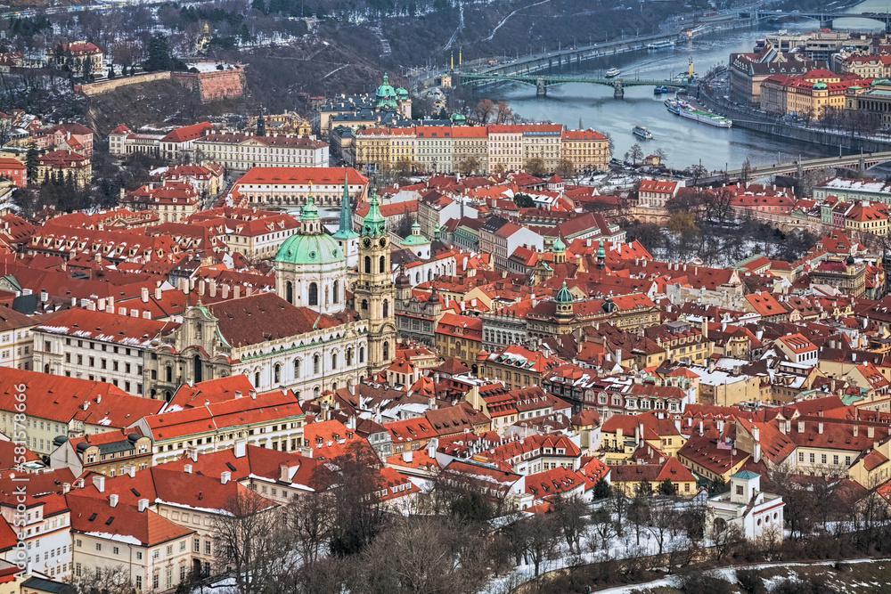 Prague, Czech Republic. Mala Strana district with St. Nicholas Church in winter. Hight angle view from the lookout tower at Petrin Hill.