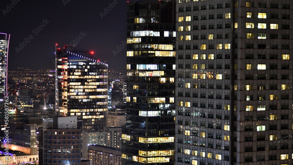 View of at night glass buildings and modern business skyscrapers,. View of modern skyscrapers and  business buildings in downtown. Big city at night.